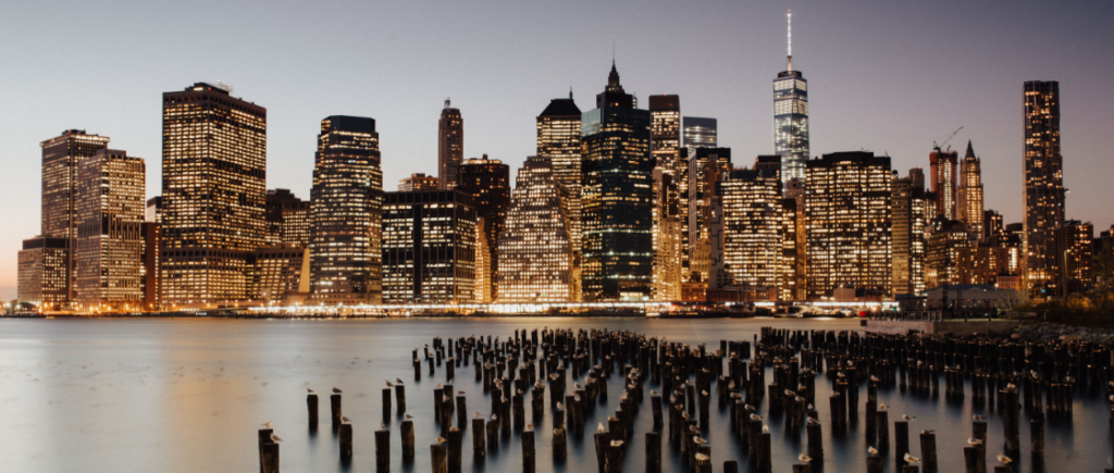 NYC skyline at night, from across the water.