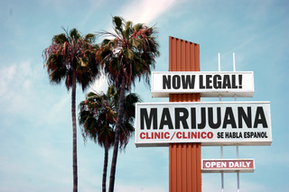 aged and worn vintage photo of  legal marijuana sign