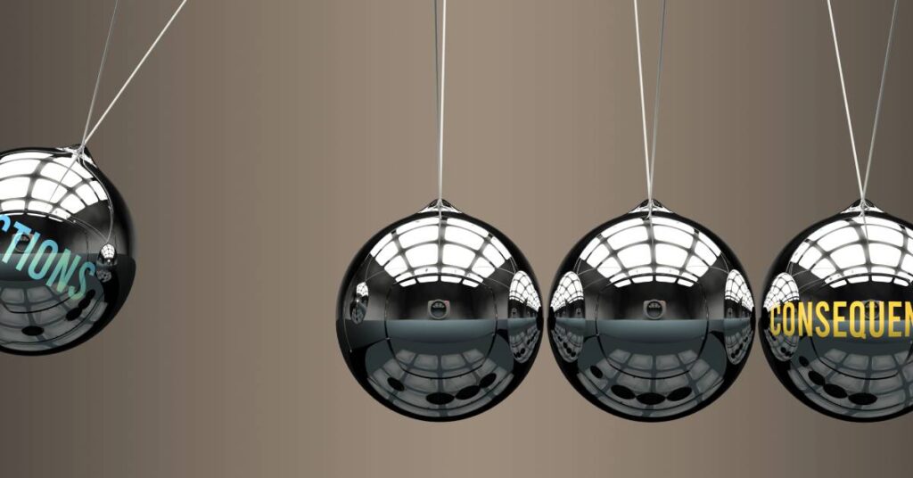 One suspended metal ball labeled "actions" swings towards a row of three balls. The last ball is labeled "consequences."